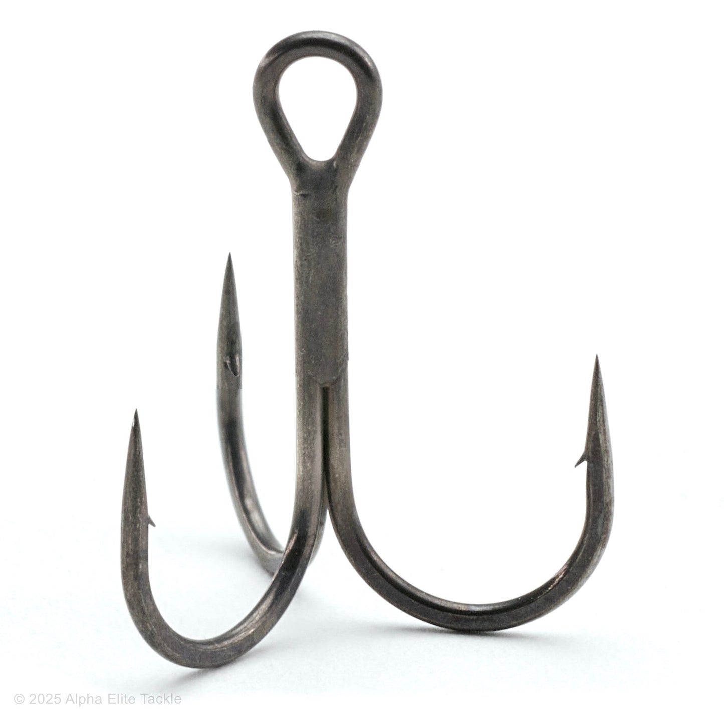 close up of the jackall treble r treble hook out of the package on a white background