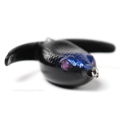 Close up of the Deps Basirisky Soft Crawler Frog in the color Jet Black on white background.