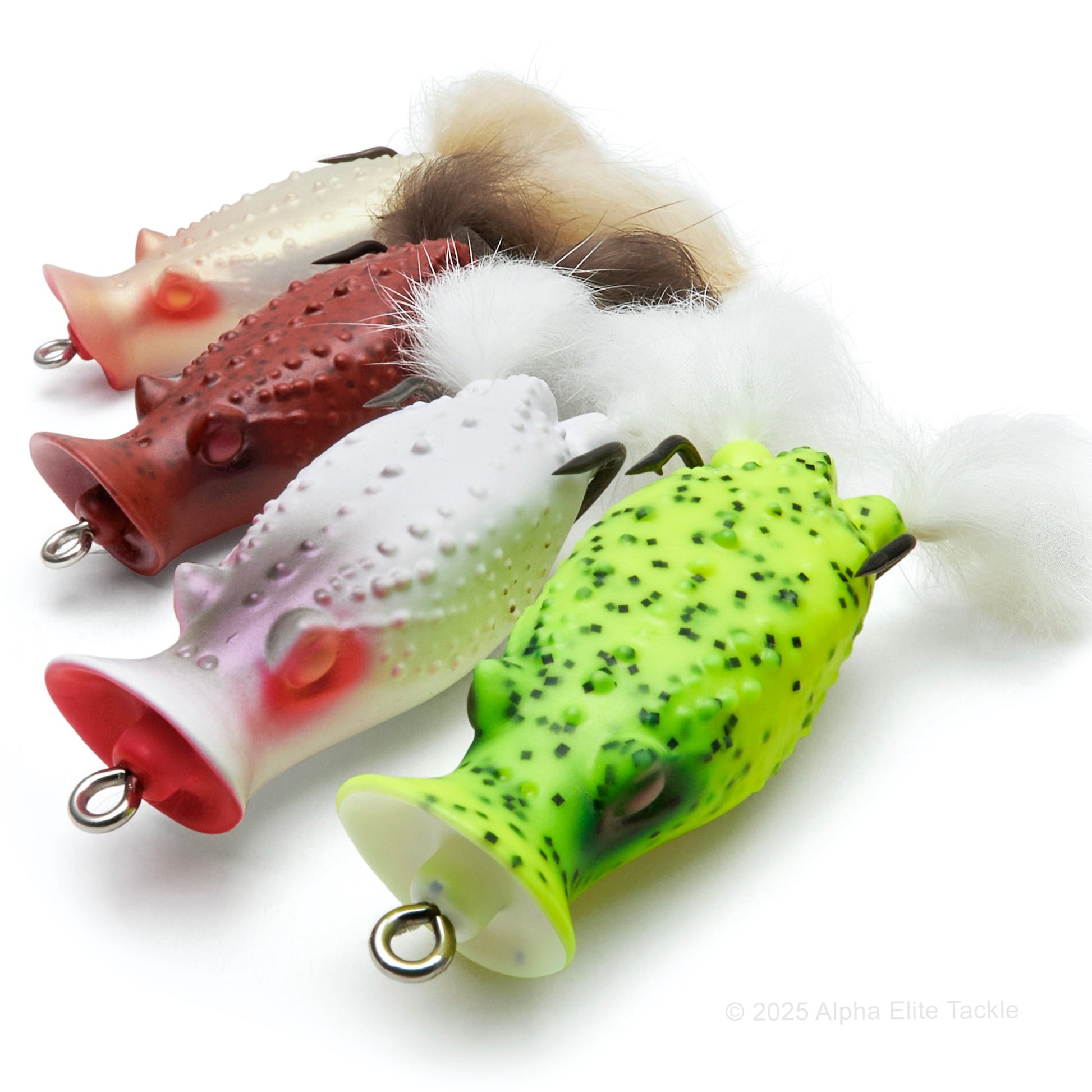 Close up of four Deps Buster K Hollow Body Popping Frogs out of their package on a white background.