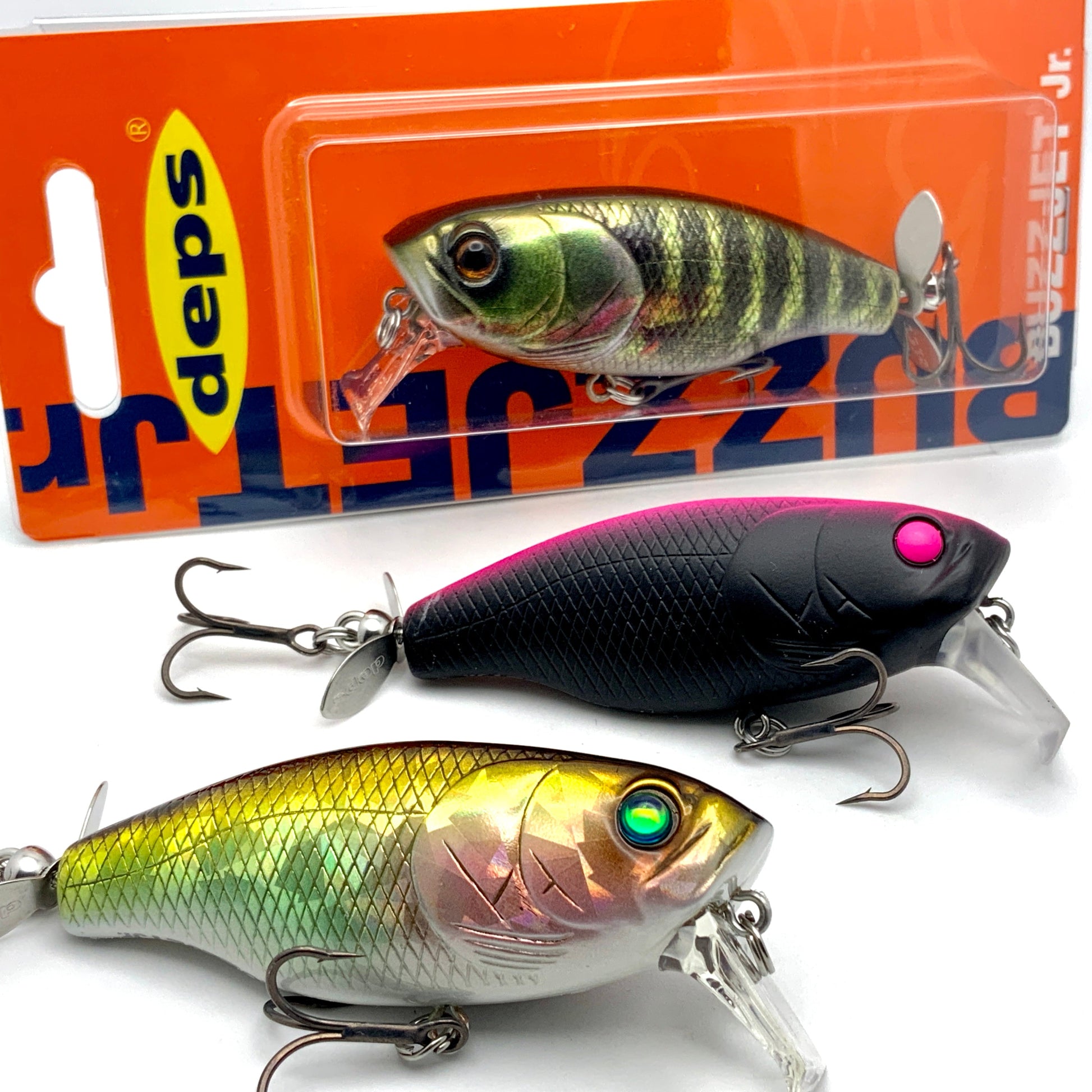 Close up of three Deps Buzzjet Wakebait Topwater lures on a white background