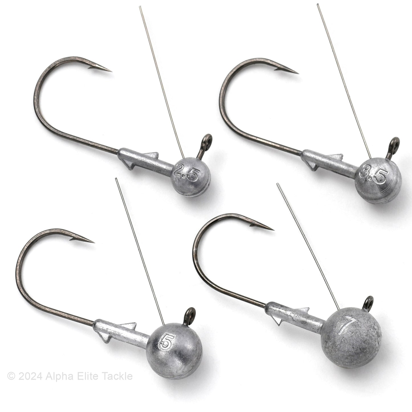 Close up of four Deps Midst Jig Heads on a white background