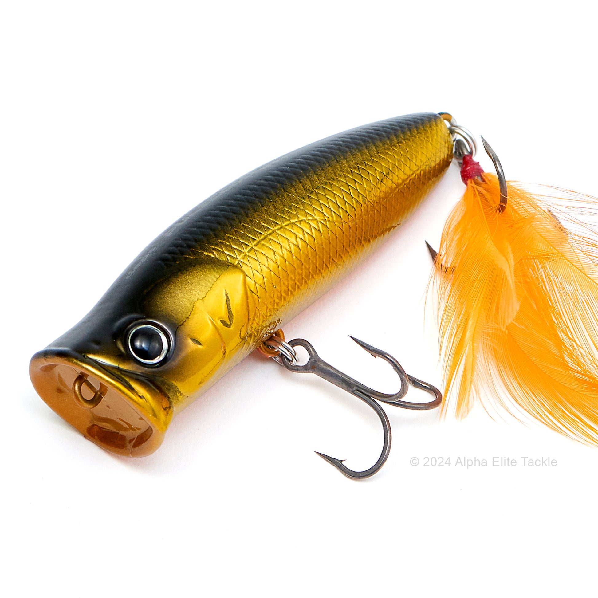 Close up of the Deps Pulsecod Topwater Popper in the color GM Black Gold on a white background