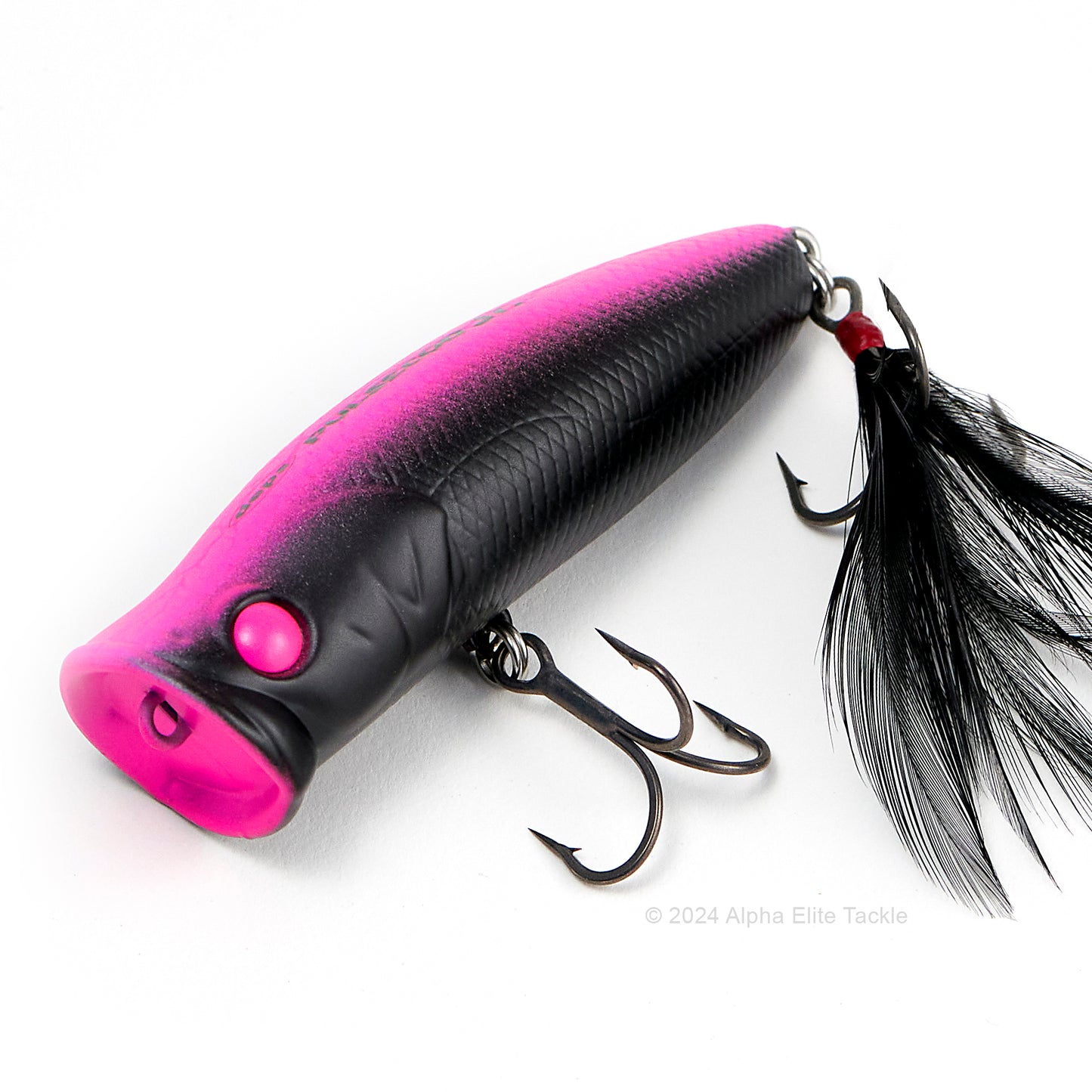 Close up of the Deps Pulsecod Topwater Popper in the color Visible Black on a white background