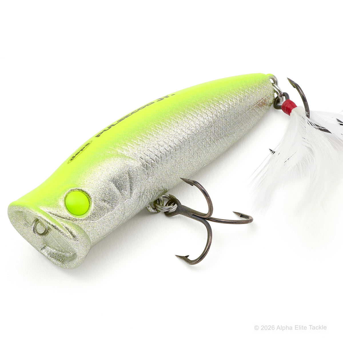 A hard bait fishing lure with a metallic silver body, a bright neon yellow-green top, a matching neon yellow-green eye, and a white feather fly tail with a red bead, shown on a white background.