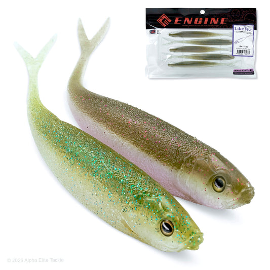 Two soft plastic fishing lures shaped like small fish, shown on a white background with a packaged version of the same lures in the upper right. The lures have a translucent olive-green back, pale yellow belly, and glittery green and pink/silver scales.