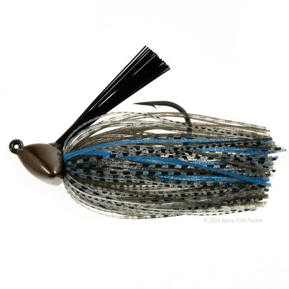 Close up of one Evergreen Grass Ripper Jig in the color Bluegill on a white background.