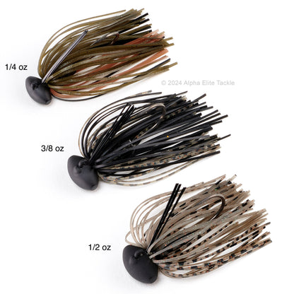 Close up of three different sizes of the Evergreen Tungsten Blow Football Jigs on a white background.
