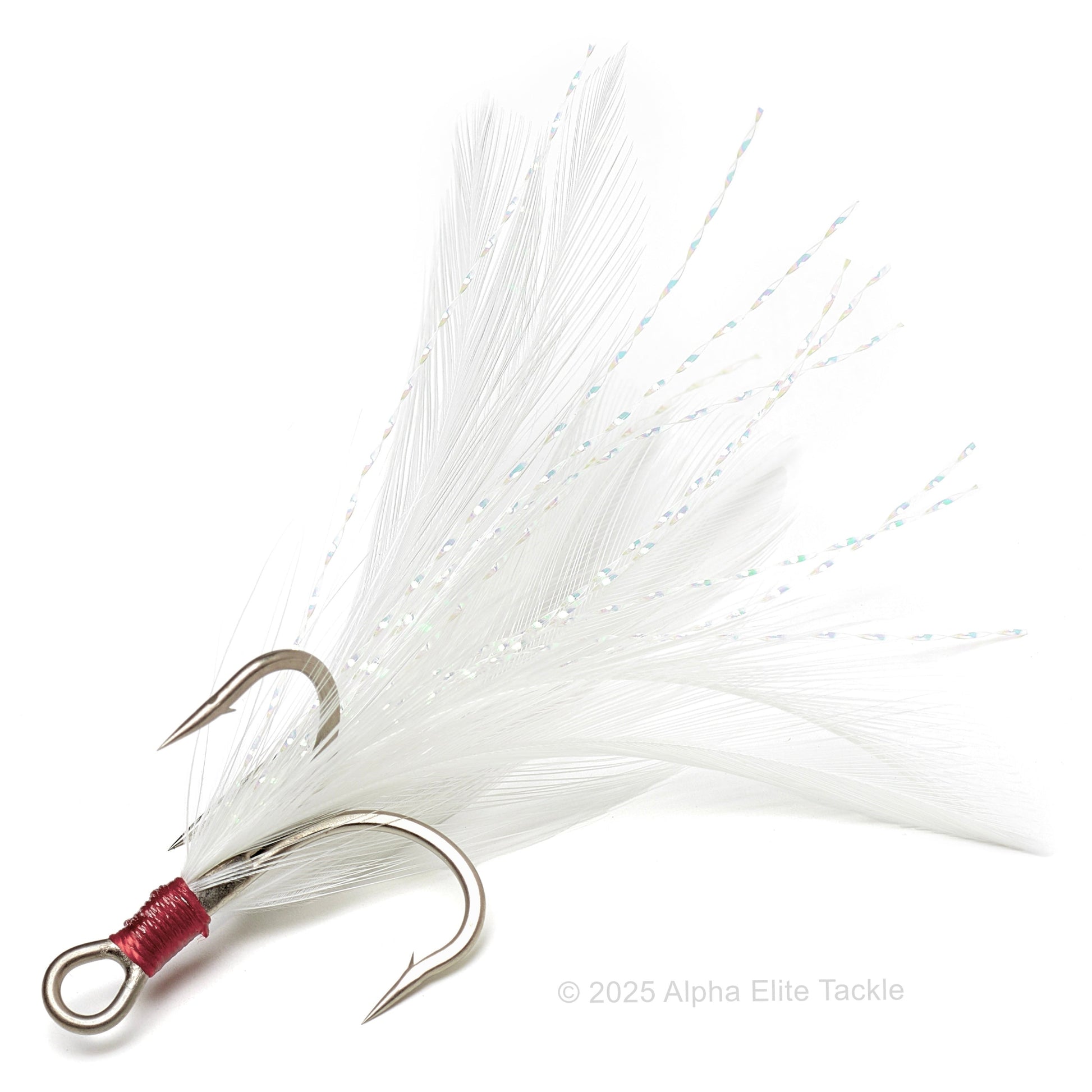 Close up of one evergreen treble magic feather hook on a white background