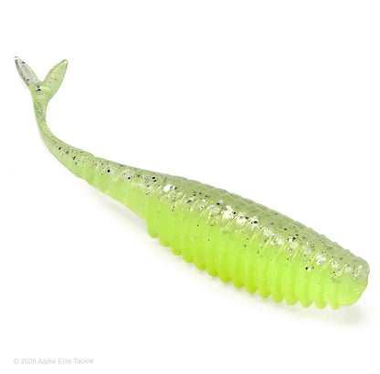 A transparent chartreuse with black and silver flake soft plastic fishing lure in the shape of a fish with a ribbed body and split tail, photographed on a clean white background.