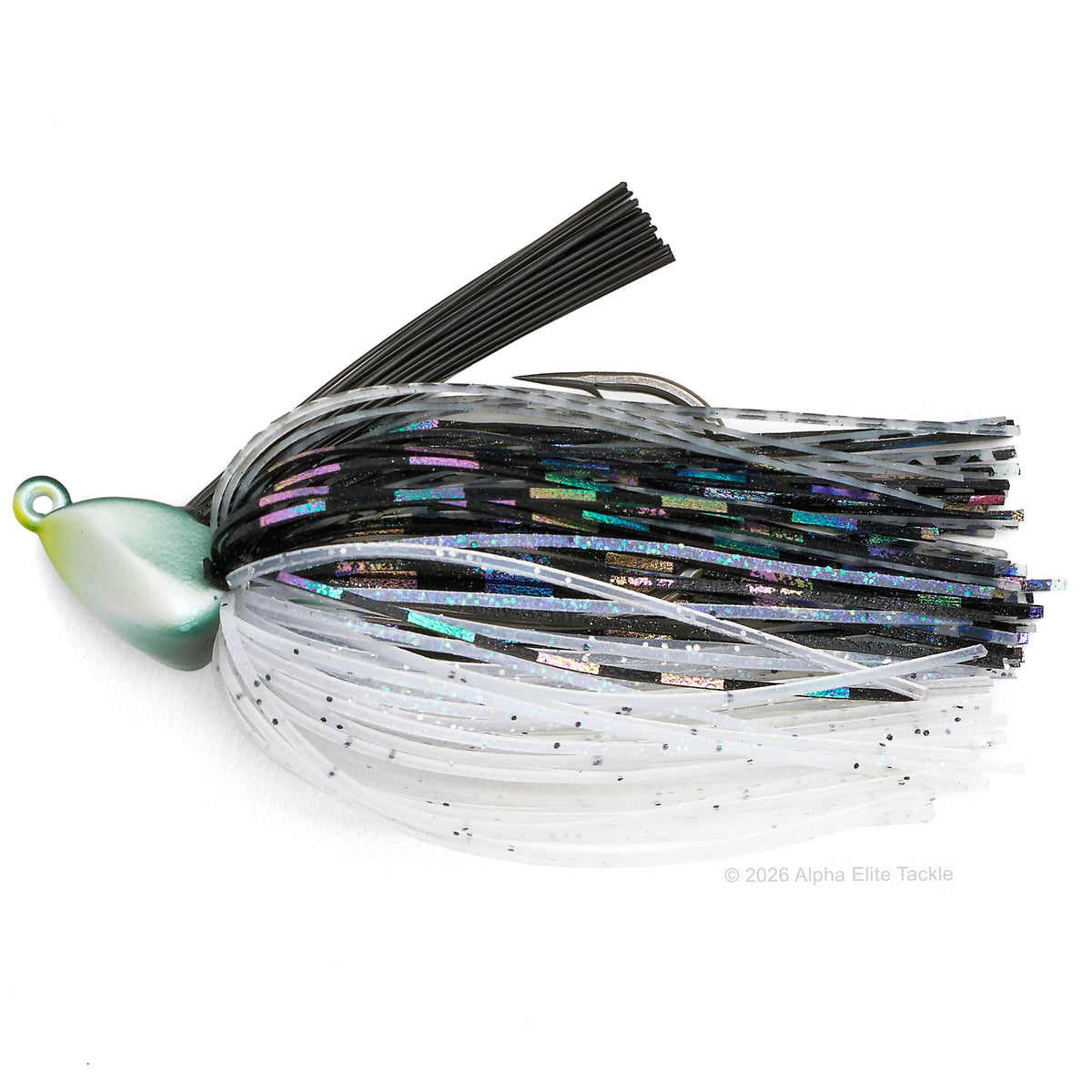 A fishing jig lure with a metallic green and gold blade, black split hooks, and dual-colored skirts. The skirt features a top band of black strands and a bottom band of translucent white strands with fine black glitter.