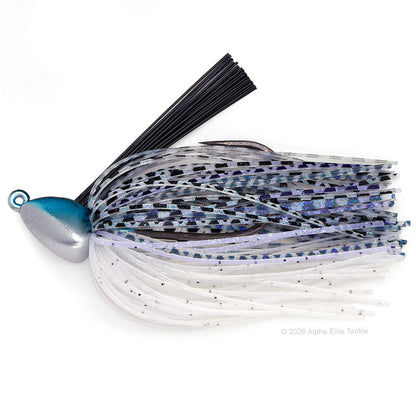 A fishing jig lure with a metallic blue and silver head, black skirt strands, and a skirt made of clear, white, and blue glittery material, shown on a white background.