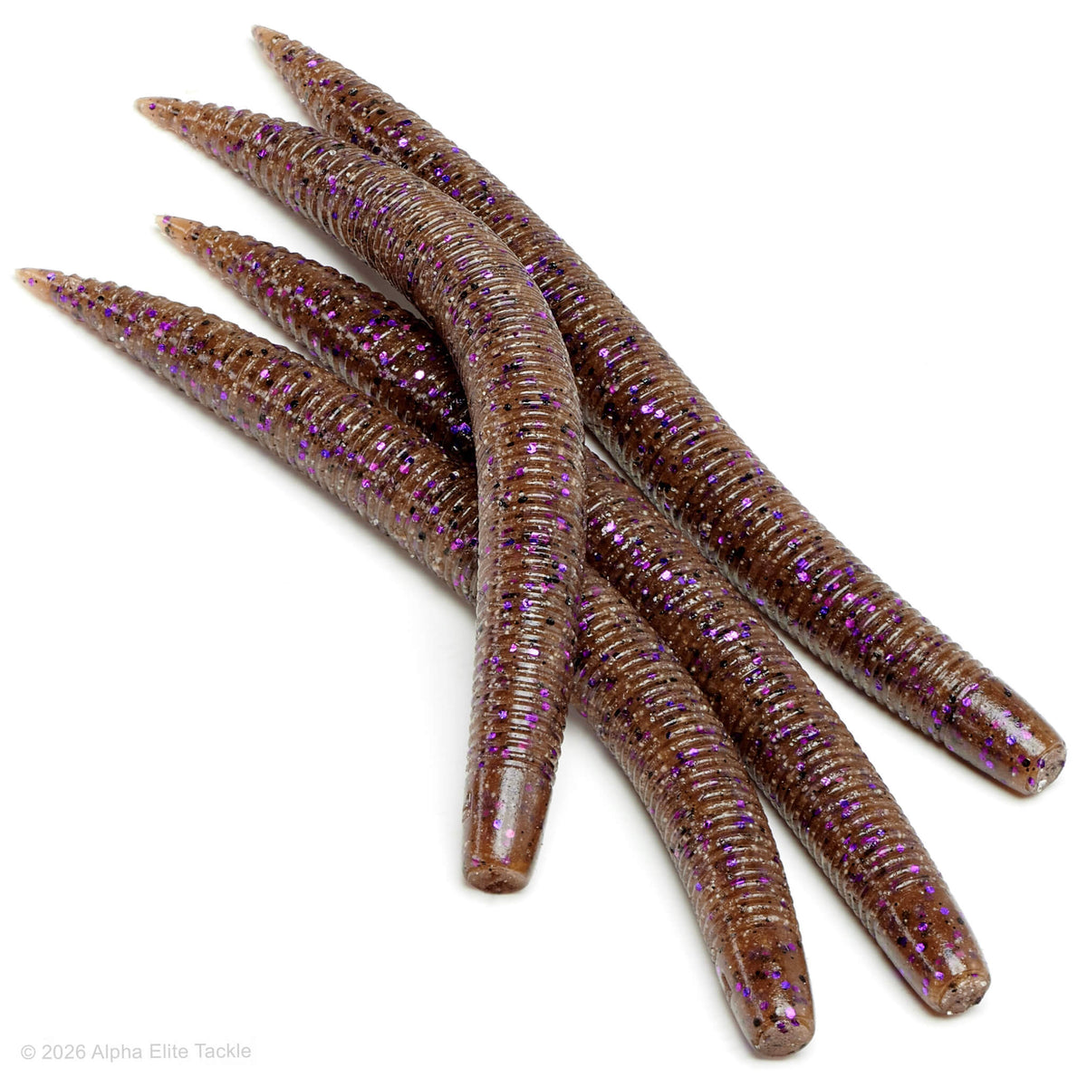 Close-up of multiple brown soft plastic ribbed stick baits with black and purple flake on a white background.
