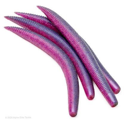 Close-up of multiple pink and purple soft plastic ribbed stick baits with black and purple flake on a white background.
