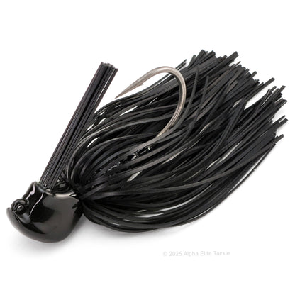 Close up of one Jackall Anarchy Flipping Jig in the color Solid Black on a white background.