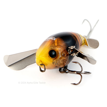 Close up of the Jackall Micro Pompadour Topwater Crawler in the color Dokunasis Hornet on a white background