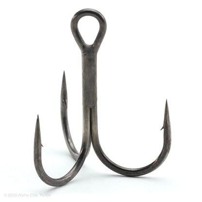 close up of the jackall treble r treble hook out of the package on a white background