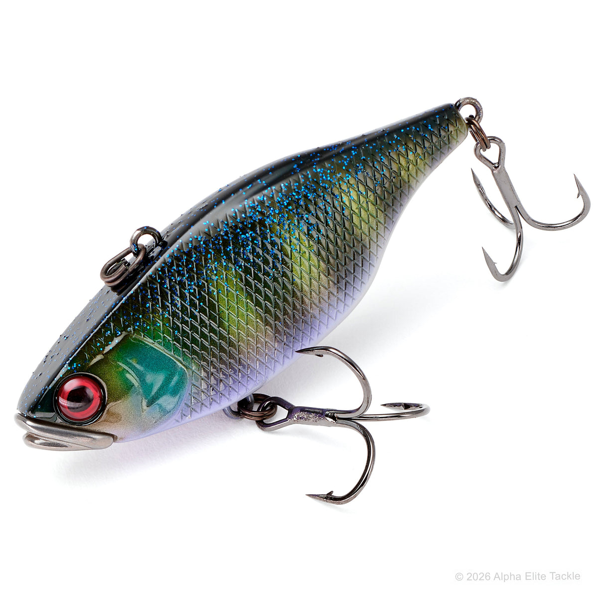 A hard fishing lure with a realistic fish design, featuring a metallic green and blue scale pattern, a red eye, and two treble hooks attached, shown on a white background.