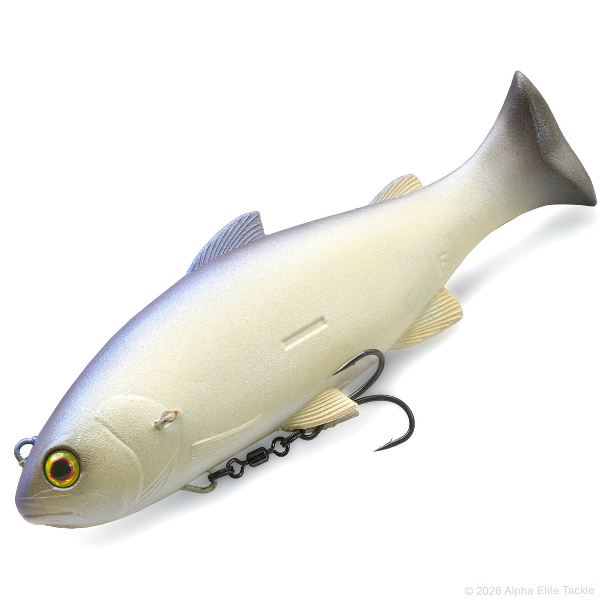 A realistic soft plastic fishing lure shaped like a fish, shown on a clean white background. The lure has a cream-white body with a silver-blue back, gold-toned eye, and black treble hooks attached underneath.