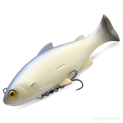 A realistic soft plastic fishing lure shaped like a fish, shown on a clean white background. The lure has a cream-white body with a silver-blue back, gold-toned eye, and black treble hooks attached underneath.