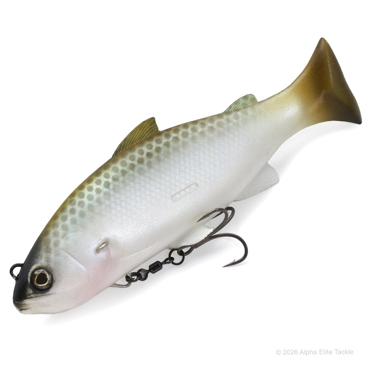 A soft plastic fishing lure shaped like a trout, featuring a realistic scale pattern in olive green, silver, and white, with a black treble hook attached. The lure is photographed on a clean white background.