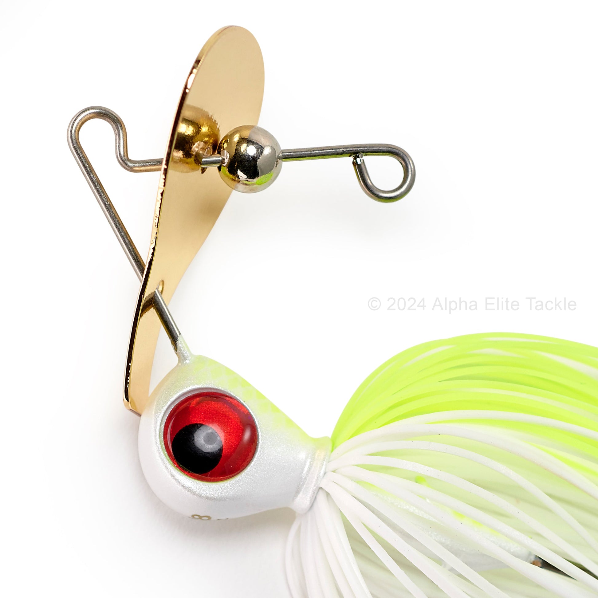 Close up of the gold blade of the Keitech Rumblade Bladed Swim Jig on a white background