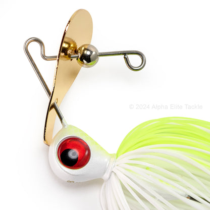 Close up of the gold blade of the Keitech Rumblade Bladed Swim Jig on a white background