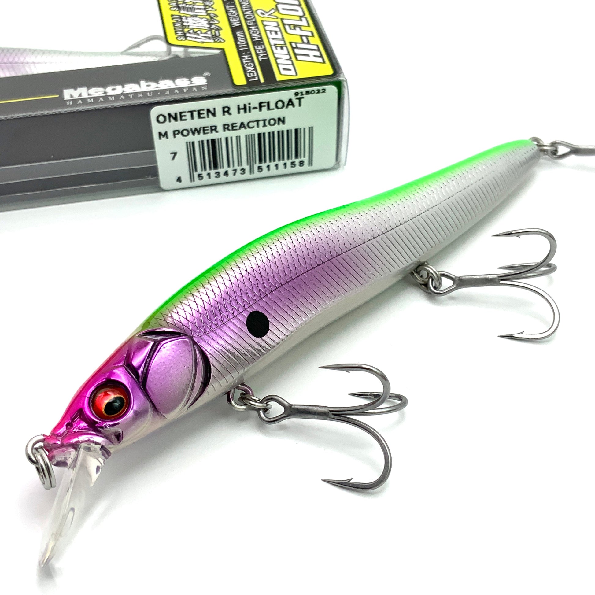 Fishing lure with purple and green body and Megabass packaging in the background