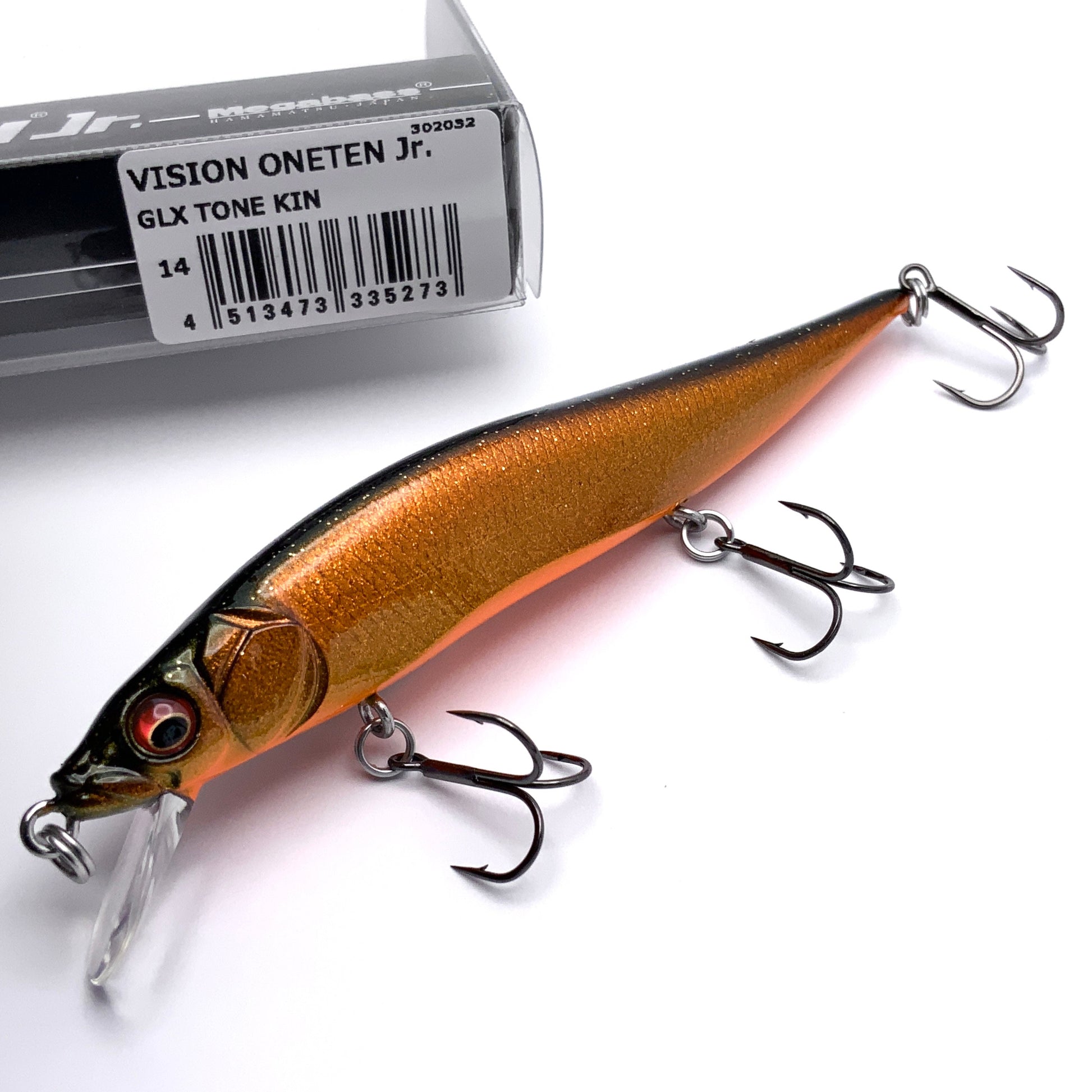 Megabass Ito Vision Oneten junior Jerkbait in the color GLX Tone Kin on a white background