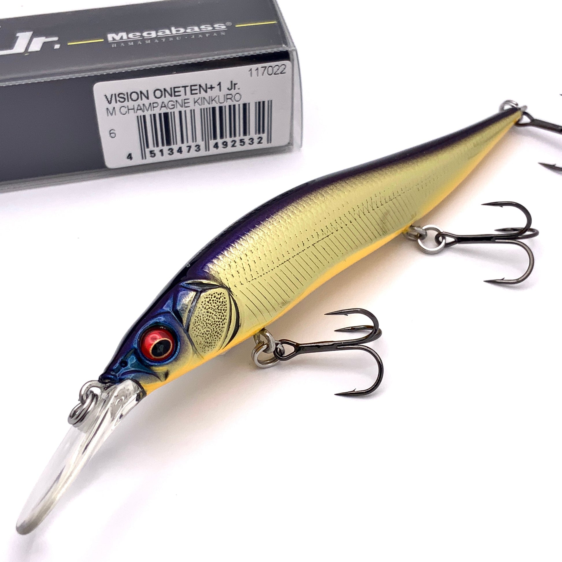 Megabass Ito Vision Oneten plus one junior Jerkbait in the color M Champagne Kinkuro on a white background