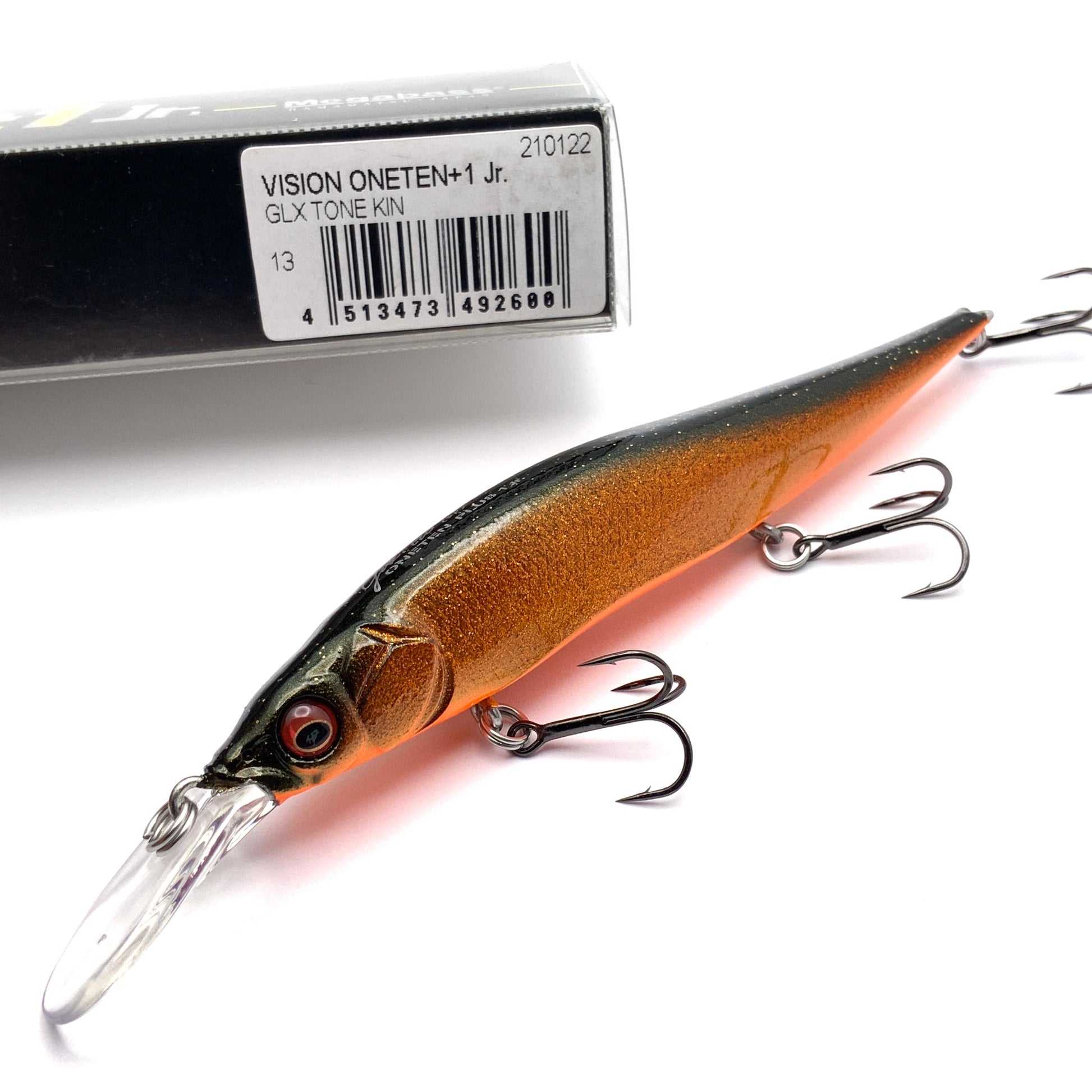 Megabass Ito Vision Oneten plus one junior Jerkbait in the color GLX Tone Kin on a white background