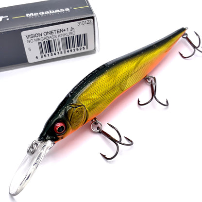 Megabass Ito Vision Oneten plus one junior Jerkbait in the color GG Megabass Kinkuro on a white background