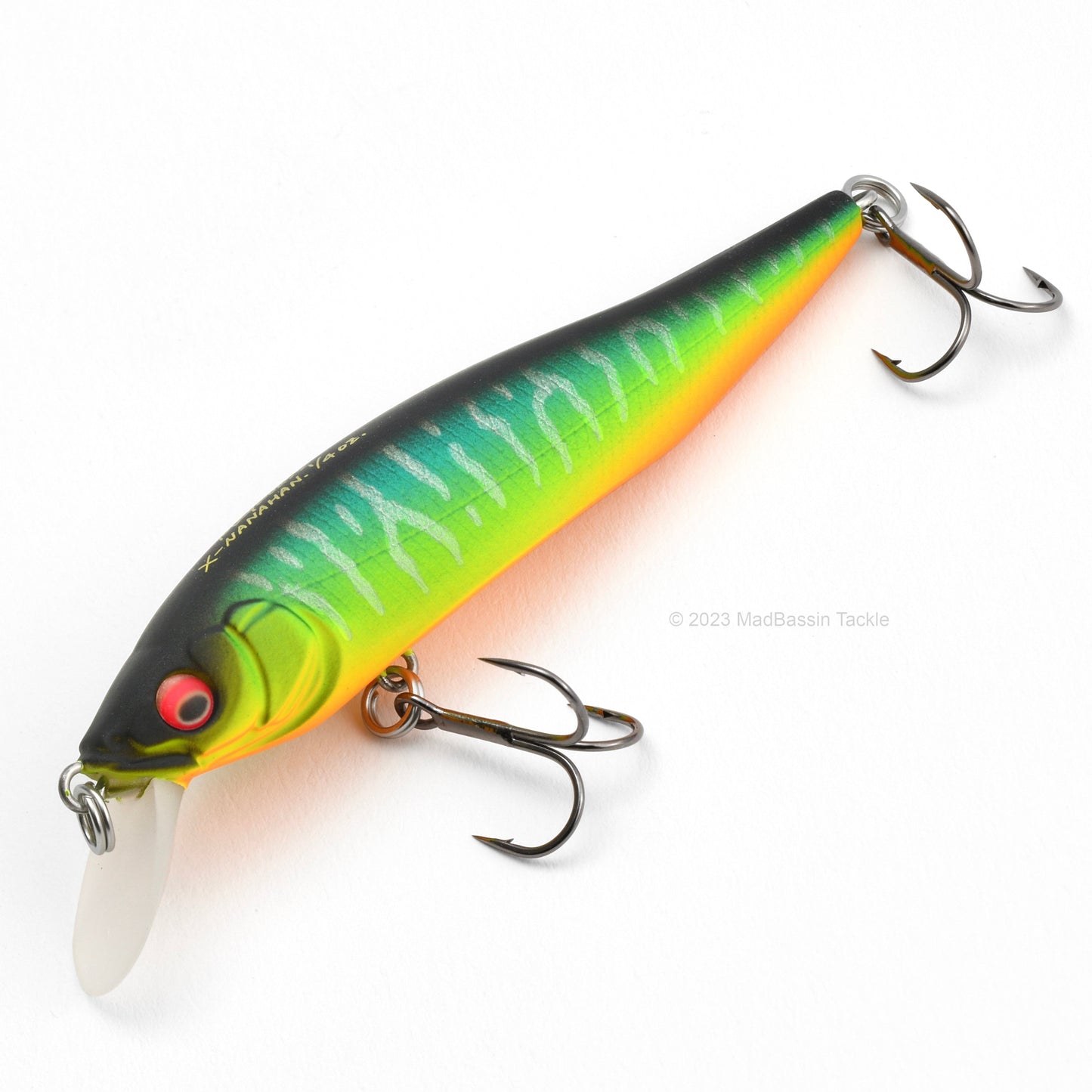 Close up of the Megabass X-75 Series X-Nanahan Jerkbait in the color Mat Tiger on a white background.