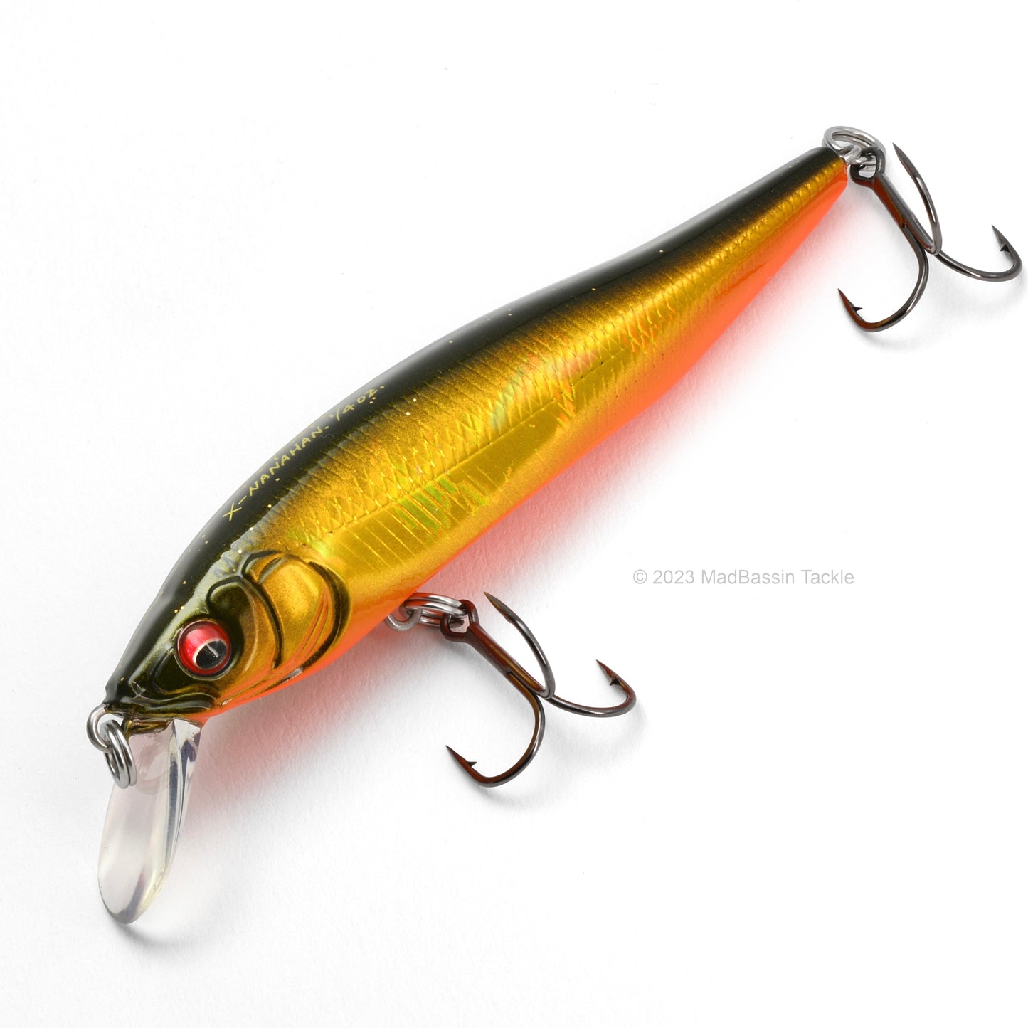 Close up of the Megabass X-75 Series X-Nanahan Jerkbait in the color GG Megabass Kinkuro on a white background.
