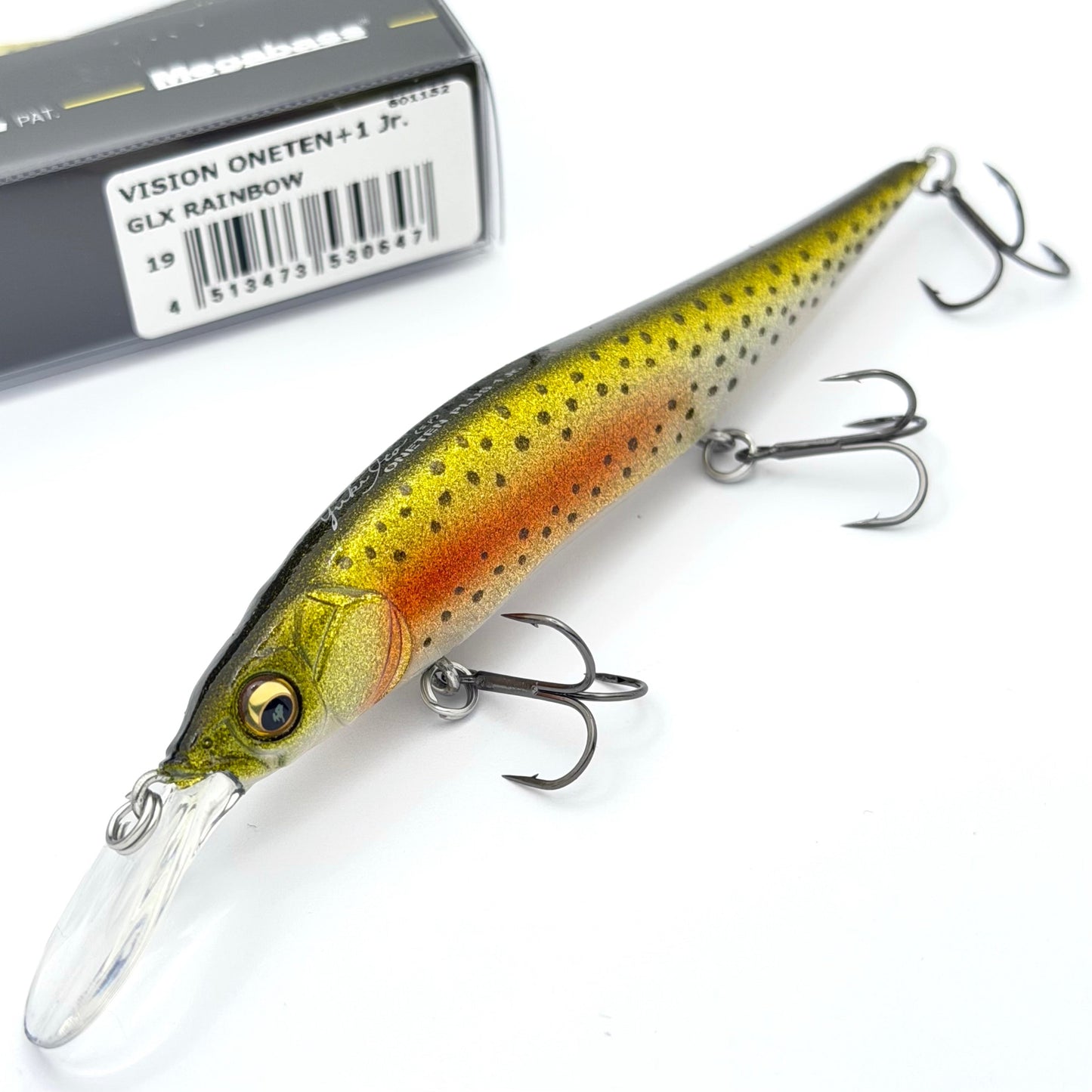 Fishing lure with treble hooks on a white background, next to a box labeled 'VISION ONETEN'.
