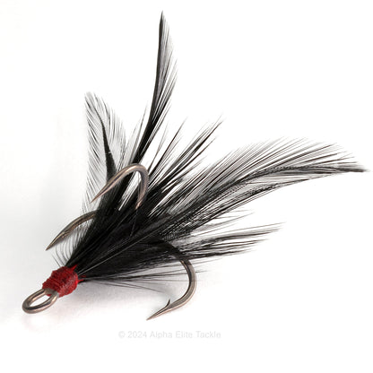 Close up of Ryugi Feathered Pierce TC Treble hook with black feathers on a white background