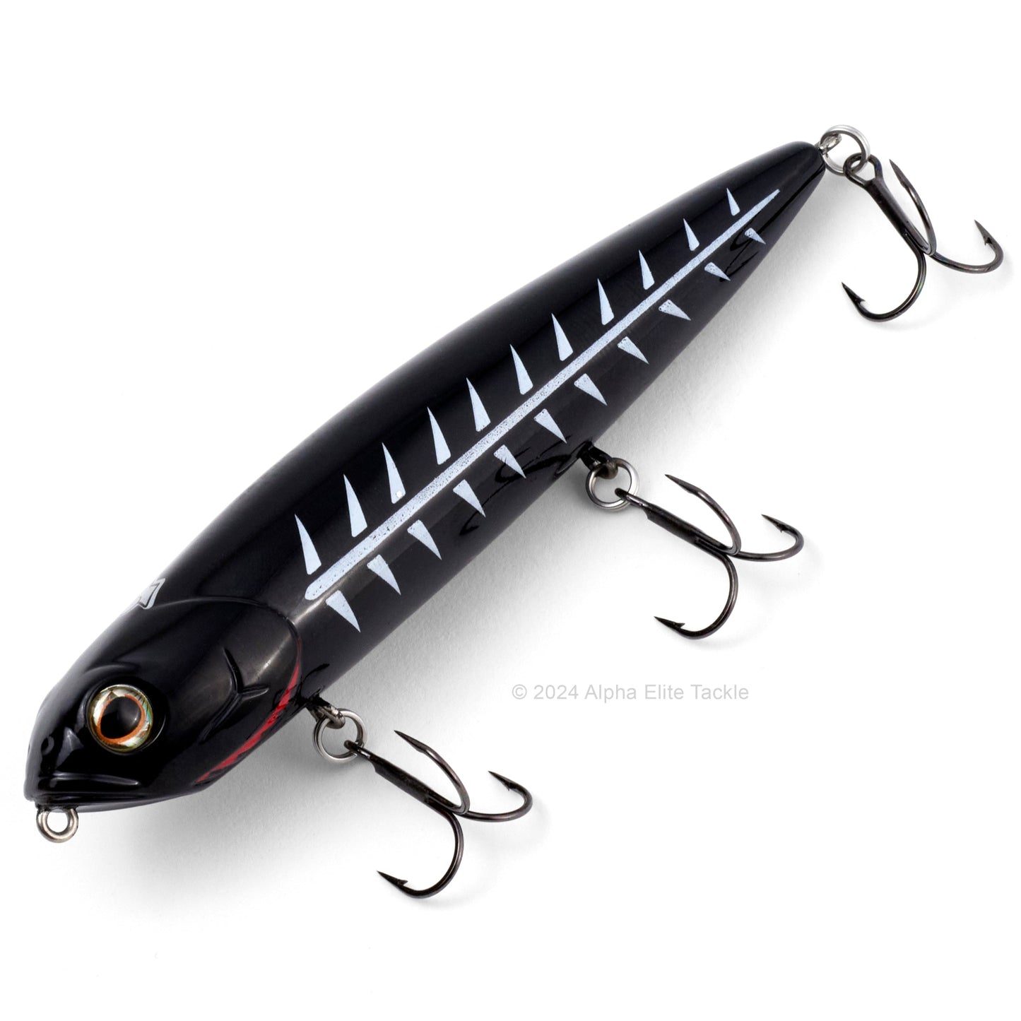 Close up of the Teckel Kicknocker Topwater in the color Black Shore on a white background